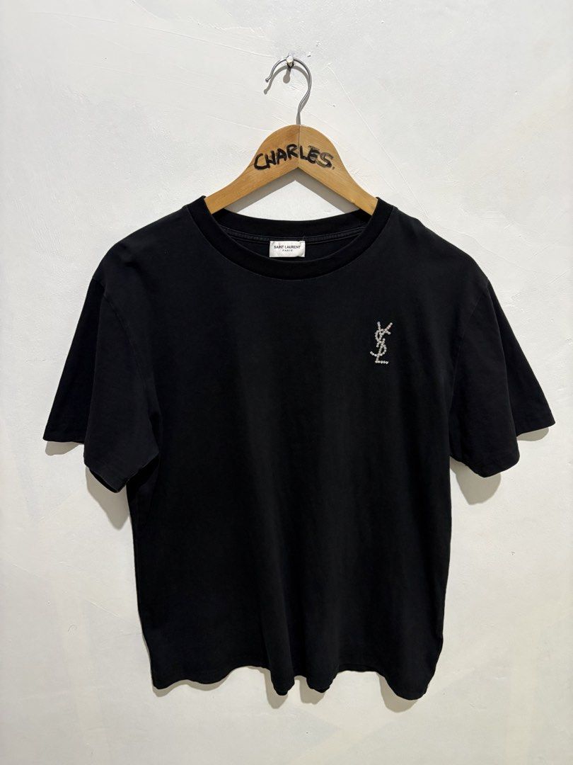 Saint Laurent Paris Black T-shirt (Category: Shirts) located in Cabanatuan. Submitted by chingweyyy (Listing ID 1433138355, Image 1). Description: - Authentic Saint Laurent Paris T-shirt - Features the YSL logo on the front - Made in Italy - Crew neck design - Product code: UP73 2022 00342 - Style code: MQ37 487783Y1241 1340 - 21 width 24 length.