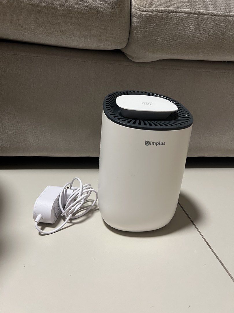 Simplus Dehumidifier (Category: Air Purifiers & Dehumidifiers) located in Muntinlupa City. Submitted by rjmlg (Listing ID 1433042920, Image 2). Description: - Simplus dehumidifier - 600ml - White and gray design - Top-mounted control panel - Includes power adapter - Ideal for small spaces - Reduces humidity and prevents mold - Easy to use and maintain Location: Sucat, Muntinlupa.