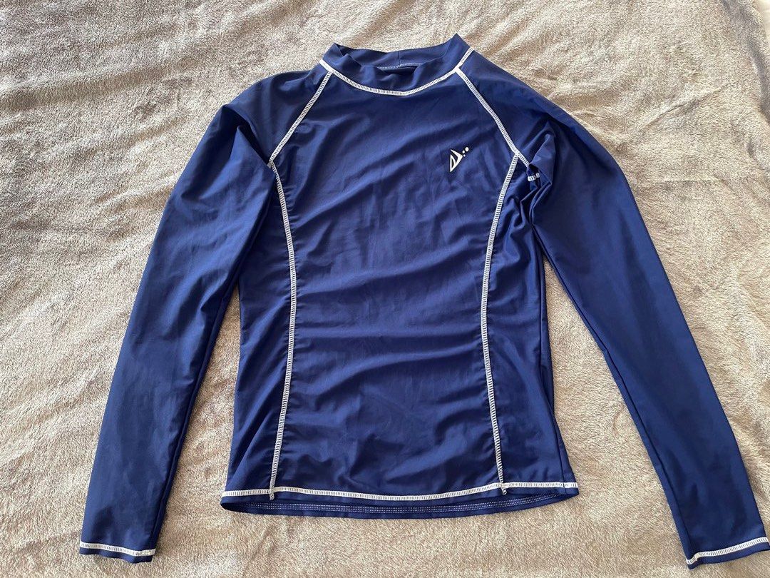 Swimsuit Set - Black and Blue rashguard (Category: Bikinis & Swimsuits) located in Paranaque City. Submitted by lilyandholly (Listing ID 1433024791, Image 3). Description: - Swimsuit set includes: - Black one-piece swimsuit with white zipper and trim - Blue long-sleeved rashguard - Black swimsuit features a high neckline and long sleeves. - Blue top has a logo on the chest. - Made of stretchy material. Fits M-L Lightly used Take all. Not sold sep
