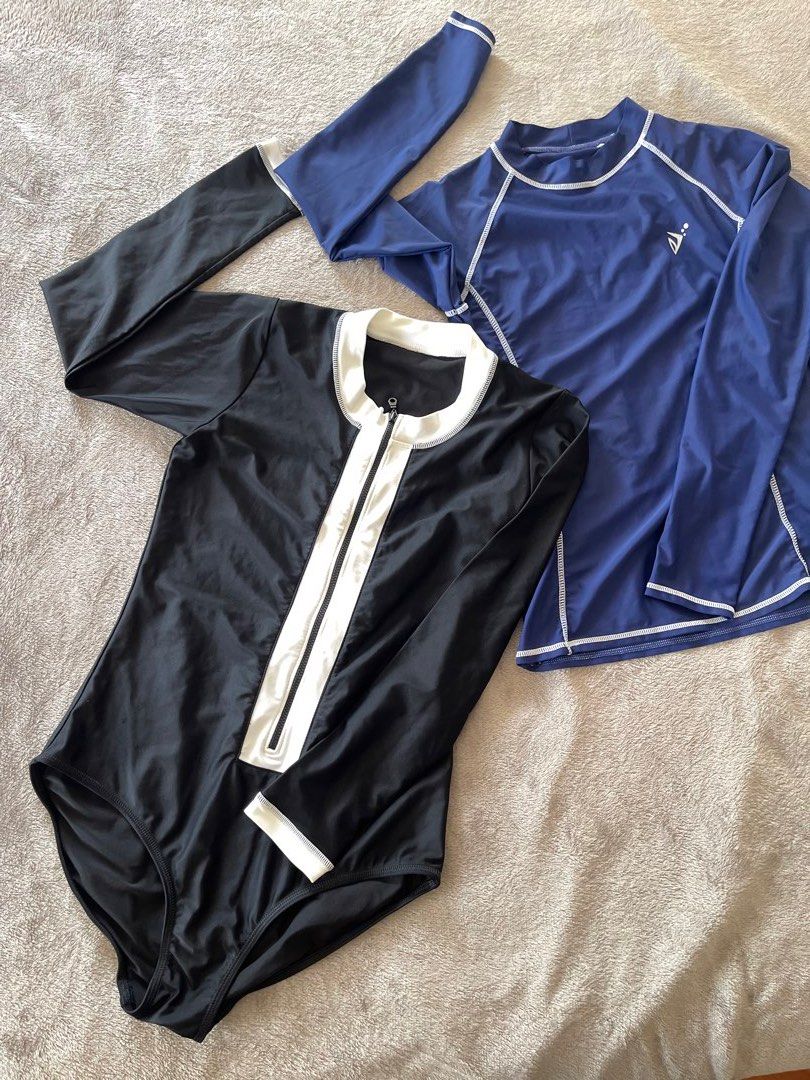 Swimsuit Set - Black and Blue rashguard (Category: Bikinis & Swimsuits) located in Paranaque City. Submitted by lilyandholly (Listing ID 1433024791, Image 1). Description: - Swimsuit set includes: - Black one-piece swimsuit with white zipper and trim - Blue long-sleeved rashguard - Black swimsuit features a high neckline and long sleeves. - Blue top has a logo on the chest. - Made of stretchy material. Fits M-L Lightly used Take all. Not sold sep