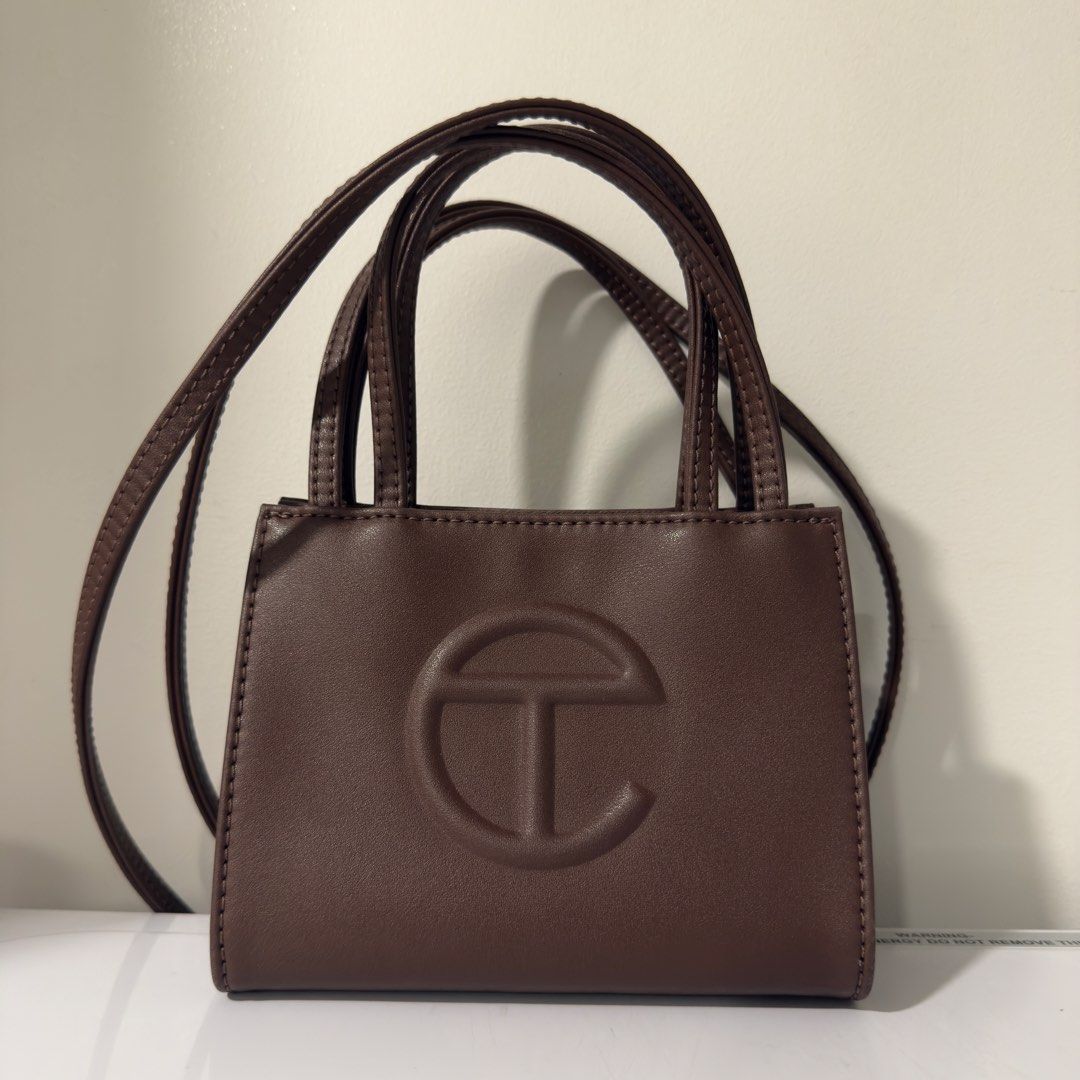 Telfar Shopping Bag Small in Chocolate (Category: Luxury Bags & Wallets) located in Taguig. Submitted by g_declutters (Listing ID 1433116509, Image 1). Description: Well loved and seller's fav! With dust bag. Sourced online for 15k. Rfs: getting a medium size.