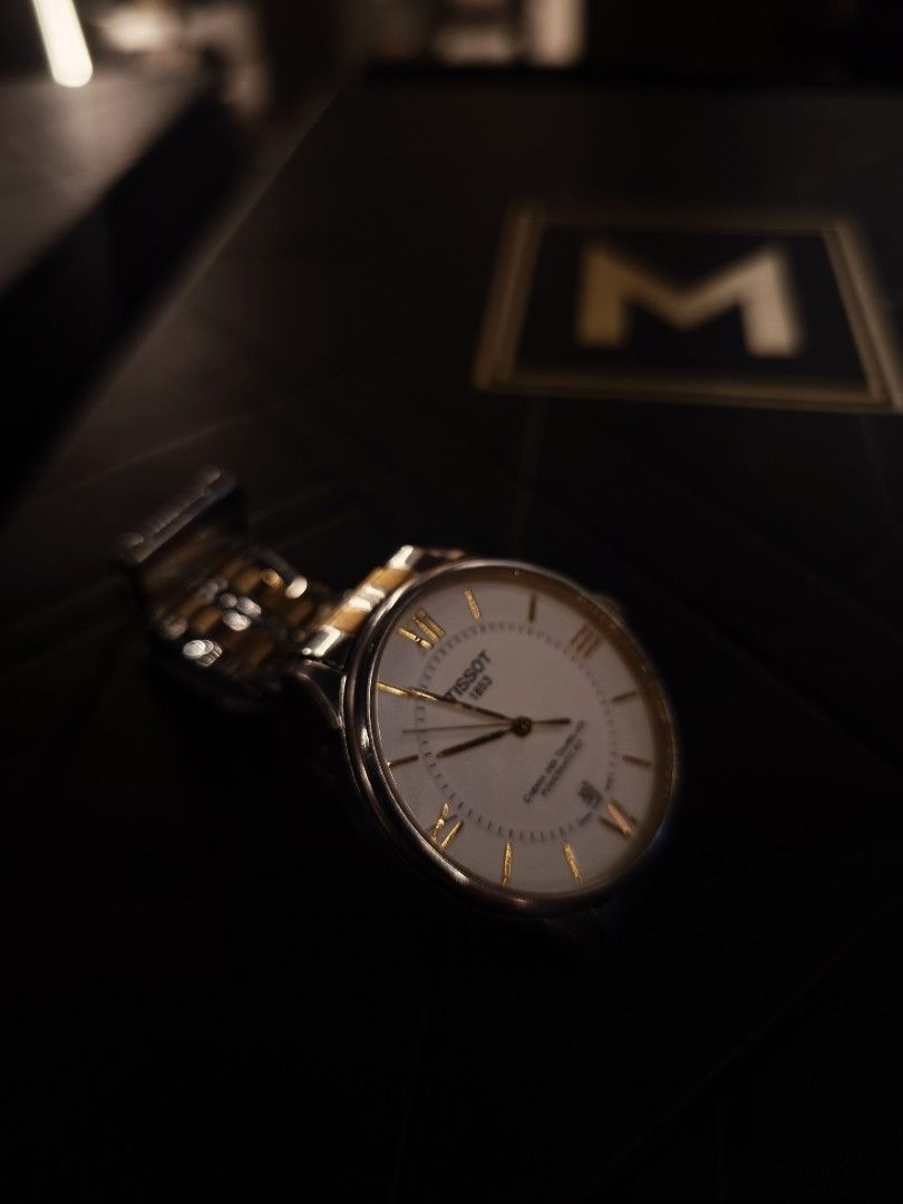 Tissot Chemin des Tourelles Automatic Watch (Category: Luxury Watches) located in Manila. Submitted by vhanlester13 (Listing ID 1433193635, Image 3). Description: - Tissot Chemin des Tourelles Automatic Watch - White dial with Roman numeral hour markers - Date display - Two-tone stainless steel and gold-tone bracelet - See-through case back - Classic design, suitable for any occasion.