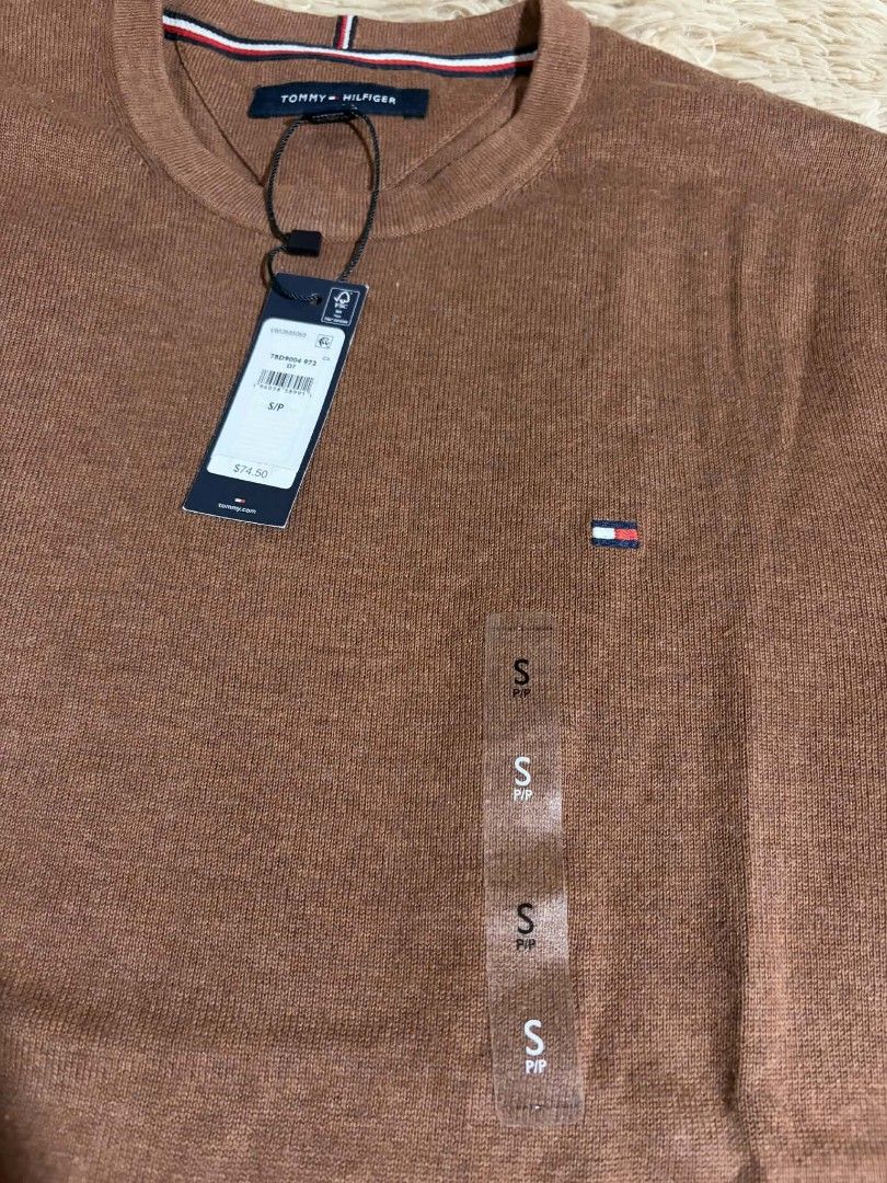 Tommy Hilfiger Crew Neck Sweater - Brown (Category: Coats, Jackets and Outerwear) located in Pateros City. Submitted by armcandystuff (Listing ID 1433044825, Image 2). Description: - Tommy Hilfiger crew neck sweater - Color: Brown - Size: Small on tag but can fit up to Large - Features Tommy Hilfiger logo - Ribbed hem and cuffs - Knit fabric.