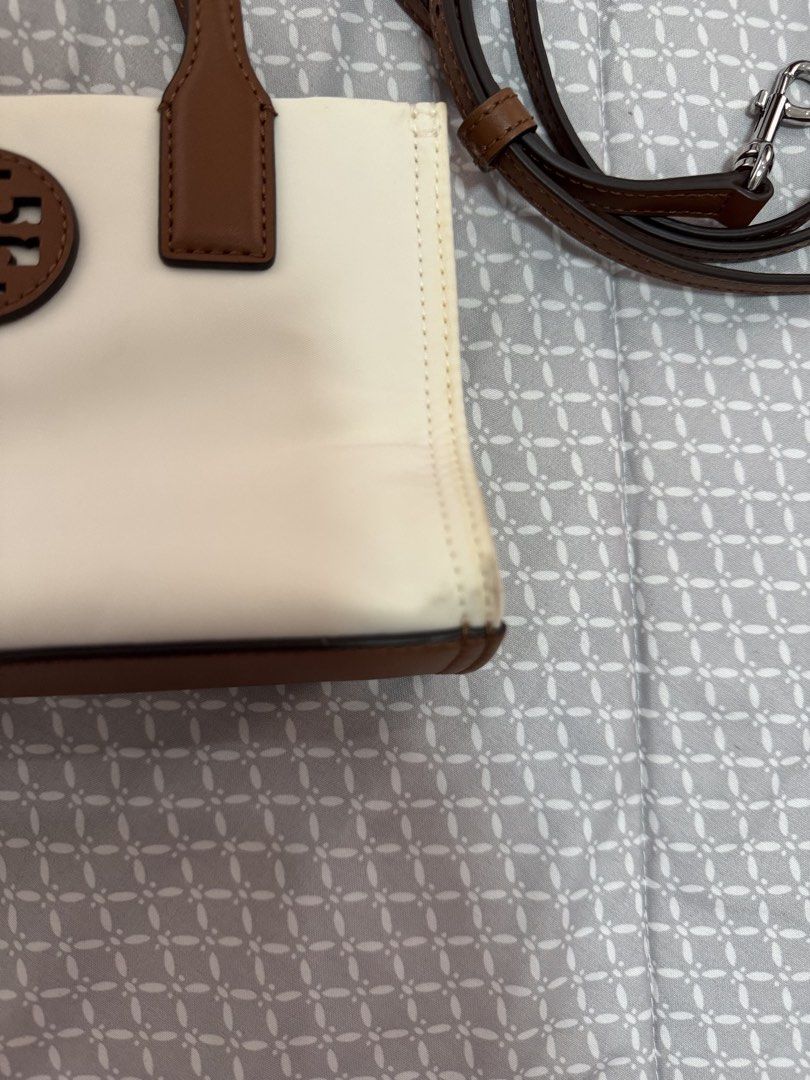 Tory Burch Ella Nylon Mini Tote (Category: Luxury Bags & Wallets) located in Dumangas. Submitted by tincajipo16 (Listing ID 1433021227, Image 2). Description: Worn once with minimal flaws due to storage. Like new condition, inside of the bag is clean. .
