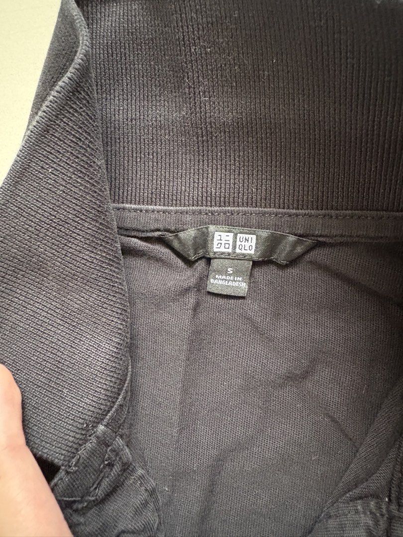 Uniqlo Black Polo Shirt (Category: Shirts) located in Quezon City. Submitted by issa1221 (Listing ID 1433097622, Image 2). Description: - Uniqlo black polo shirt - Features a mandarin collar - Short sleeves - Button-up front with white buttons.