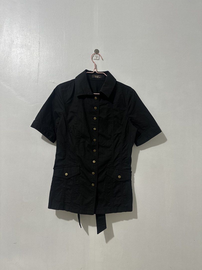 Veeko Black Short Sleeve Blouse (Category: Blouses) located in Manila. Submitted by rfibe (Listing ID 1433189369, Image 1). Description: - Veeko black short sleeve blouse - Size: S - Features: - Collared neckline - Button-down front - Two front pockets - Tie-waist detail at the back - Material: 96% cotton, 4% spandex - Design: Classic and versatile, suitable for various occasions..