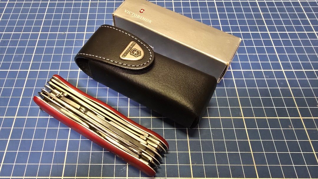 Victorinox Work Champ Swiss Army Knife (Category: Luxury Bags & Wallets) located in Cagayan de Oro. Submitted by erwin6 (Listing ID 1433143413, Image 1). Description: - Victorinox Work Champ Swiss Army Knife - Includes original leather case with Victorinox logo - Comes with original silver Victorinox box.