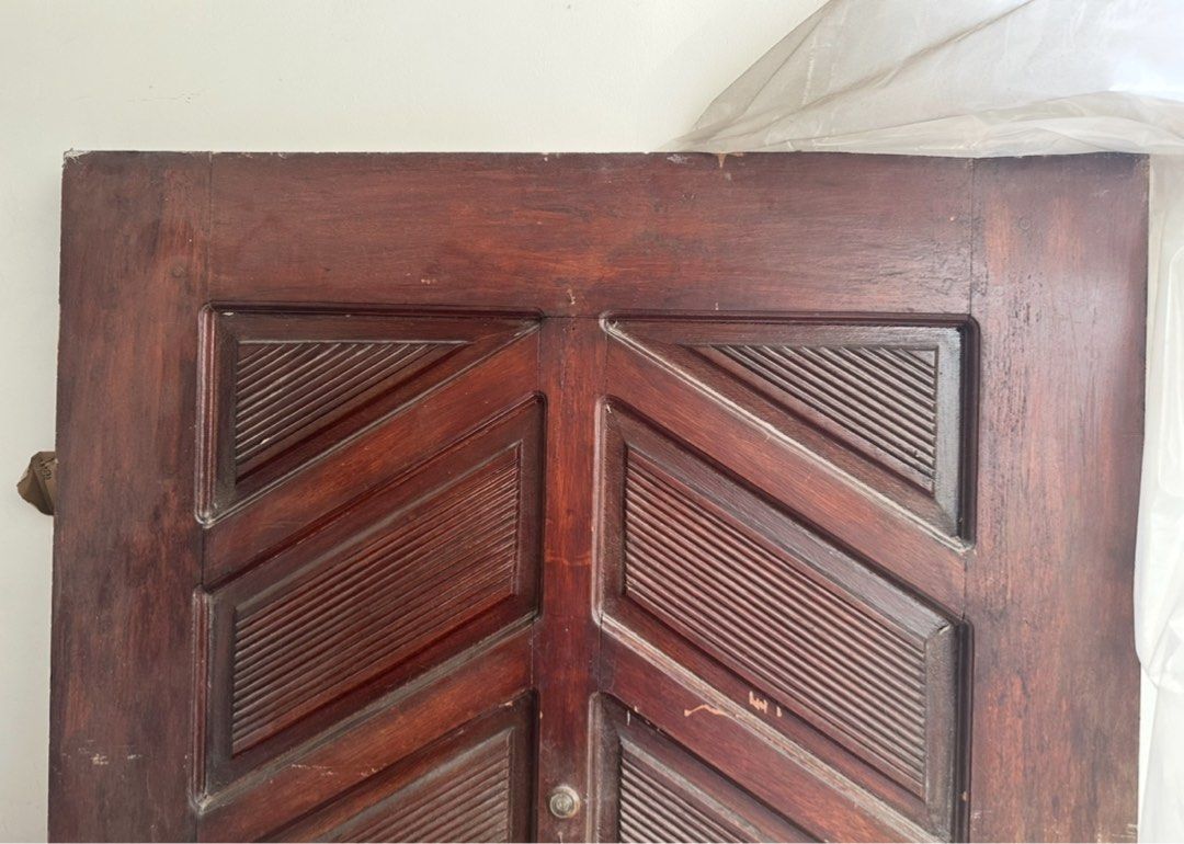 Vintage Wooden Door with Carved Details (Category: Other Home Decor) located in Quezon City. Submitted by mademoiselle_shop (Listing ID 1433051643, Image 1). Description: - 92x198cm 1970s solid wood door From 10k selling price - Vintage wooden door - Intricate carved details - Rich, dark brown color - Unique geometric design - Includes door knob and hardware - Solid wood construction - Adds vintage charm.