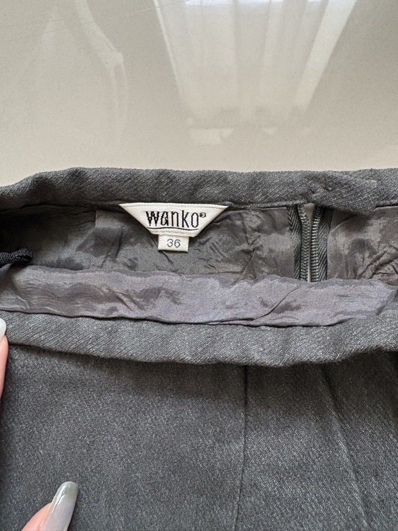 Wanko Gray Skirt (Category: Skirts) located in Quezon City. Submitted by issa1221 (Listing ID 1433097856, Image 2). Description: - Wanko gray skirt - Two back pockets with decorative trim - Made of sturdy fabric - Classic design - Versatile style.