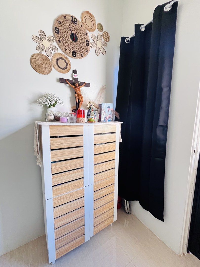 White Shoe Cabinet - 77x124x34cm (Category: Shelves, Cabinets & Racks) located in Quezon City. Submitted by kris.mansos (Listing ID 1433044966, Image 1). Description: - Breathable shoe cabinet - Large capacity for shoe storage - White frame with wooden-look doors - Multiple compartments for organization - Dimensions: 77cm (W) x 124cm (H) x 34cm (D) - Perfect for entryways and hallways.