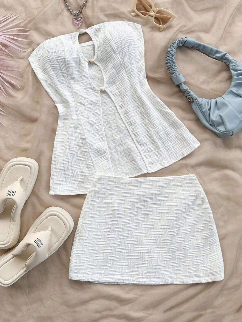 White Textured Top and Skirt Set (Category: Sets or Coordinates) located in Cagayan de Oro. Submitted by elviecup (Listing ID 1433179891, Image 1). Description: White textured top and mini skirt set. Top features keyhole detail and button closure. Perfect for casual wear..