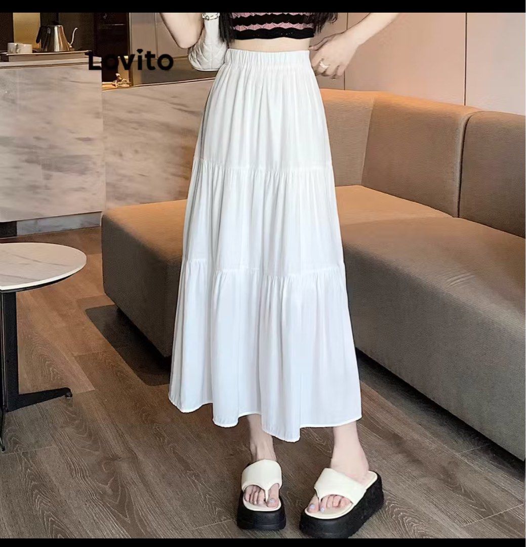 White Tiered Maxi Skirt (Category: Skirts) located in Cagayan de Oro. Submitted by declutter_clean (Listing ID 1433147314, Image 1). Description: - White maxi skirt - Tiered design - Comfortable elastic waistband - Ankle-length - Flowy silhouette - Versatile for various outfits.