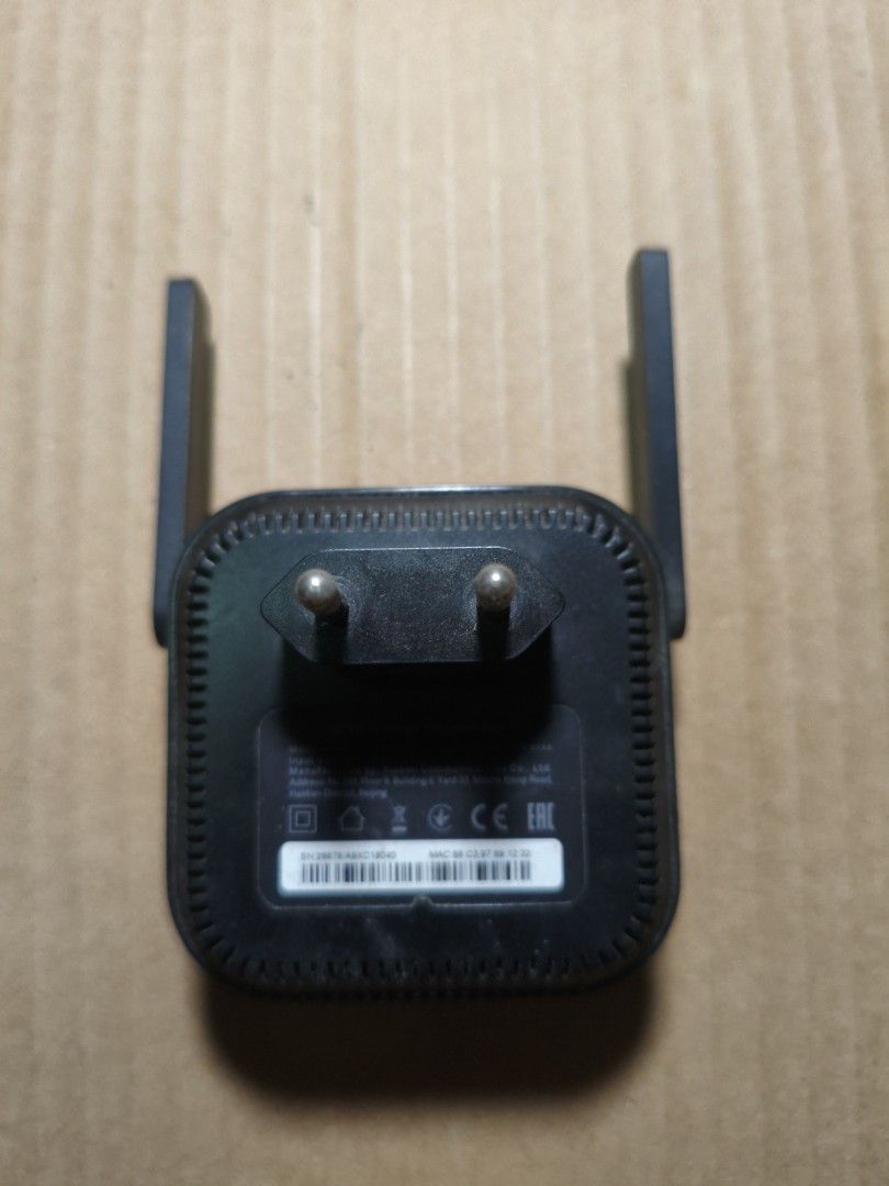 Xiaomi Mi Wi-Fi Range Extender Pro (Category: Networking) located in Pasig City. Submitted by coolphoenix-29ac (Listing ID 1433129407, Image 2). Description: - Xiaomi Mi Wi-Fi Range Extender Pro - Extends your Wi-Fi network's range - Features two antennas for improved signal - Plugs directly into a power outlet - Sleek black design - Xiaomi logo on the front.