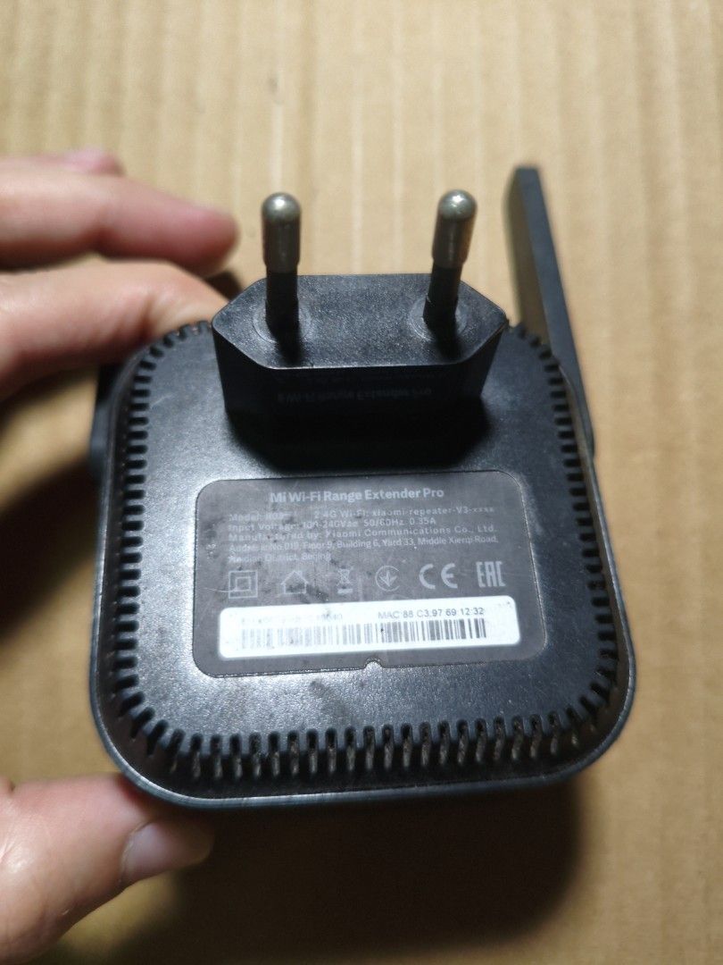Xiaomi Mi Wi-Fi Range Extender Pro (Category: Networking) located in Pasig City. Submitted by coolphoenix-29ac (Listing ID 1433129407, Image 3). Description: - Xiaomi Mi Wi-Fi Range Extender Pro - Extends your Wi-Fi network's range - Features two antennas for improved signal - Plugs directly into a power outlet - Sleek black design - Xiaomi logo on the front.