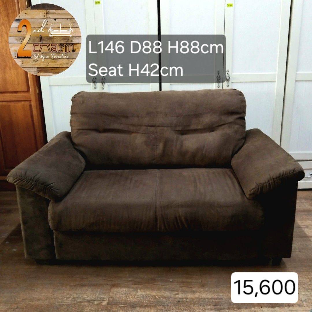 2nd hand Velvet Brown 2-Seater Sofa (Category: Sofas) located in Paranaque City. Submitted by 2ndcharmfurniture (Listing ID 1429749306, Image 1). Description: Comfortable 2-seater sofa in a rich brown color. Features a plush, cushioned design with wide armrests. Dimensions are L146cm, D88cm, H88cm, with a seat height of 42cm. Perfect for living rooms or lounges. The sofa has a sturdy wooden frame..