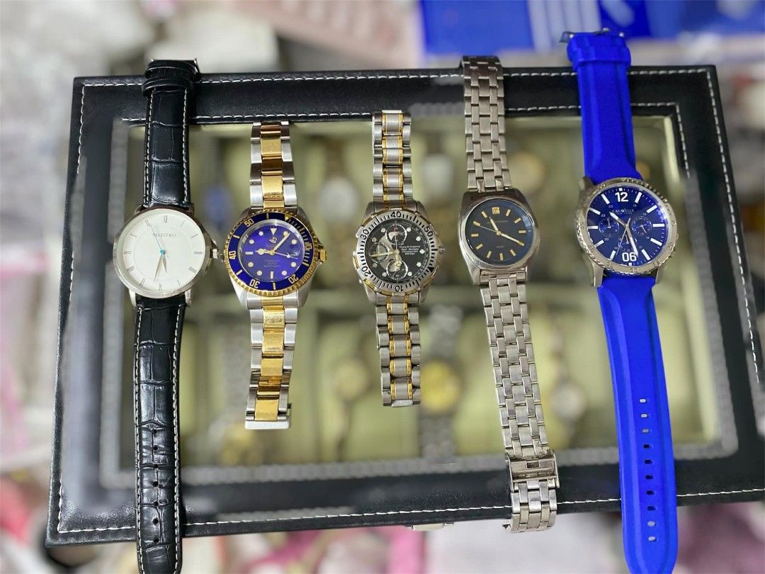 ✨ MEN'S Assorted Watches ✨ (Category: Men's Watches) located in Bulacan. Submitted by shopyourstyleph (Listing ID 1429763004, Image 1). Description: Collection of assorted watches. Includes watches with black leather straps, gold and silver bracelets, and blue silicone straps. Some watches have blue dials, while others have black or white dials. MAESTRO SPADOLINI ITALY TOWN & COUNTRY LUCIANO FORNERIS CARAVELLE.