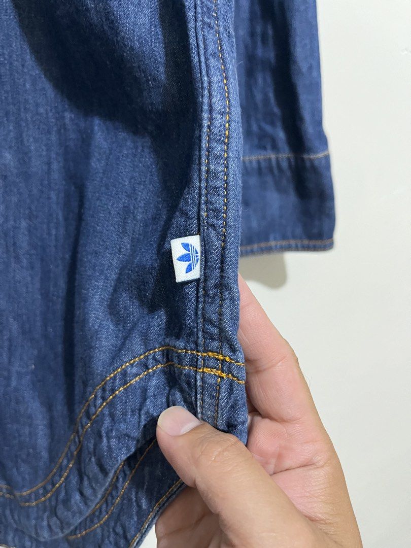 Adidas denim long-sleeve shirt (Category: Shirts) located in Quezon. Submitted by sickdropz (Listing ID 1429806750, Image 3). Description: - Adidas denim long-sleeve shirt -Size - Best fit small ( 17.5 x 32 ) - Collared neckline - Button-down front - Adidas logo on chest - Curved hemline and buttoned cuffs - Made in India - 100% cotton Price - 400 + Shipping fee Quezon province location Pm for those interested .
