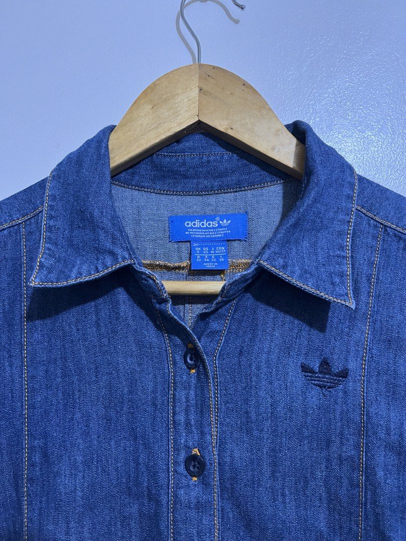 Adidas denim long-sleeve shirt (Category: Shirts) located in Quezon. Submitted by sickdropz (Listing ID 1429806750, Image 2). Description: - Adidas denim long-sleeve shirt -Size - Best fit small ( 17.5 x 32 ) - Collared neckline - Button-down front - Adidas logo on chest - Curved hemline and buttoned cuffs - Made in India - 100% cotton Price - 400 + Shipping fee Quezon province location Pm for those interested .
