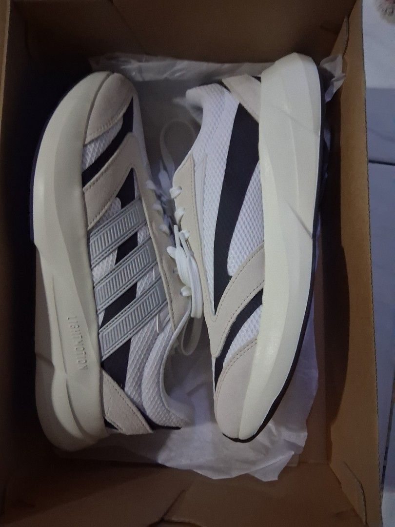 Adidas LIGHTMOTION T29 Sneakers - JQ9650 (Category: Sneakers) located in Manila. Submitted by lhiam311 (Listing ID 1429762367, Image 3). Description: Adidas LIGHTMOTION T29 sneakers in white and black. The shoes are new and come with the original box. The box shows the model number JQ9650 and a price of PHP 3,800. The size is 7 (US) and 40 (EU)..