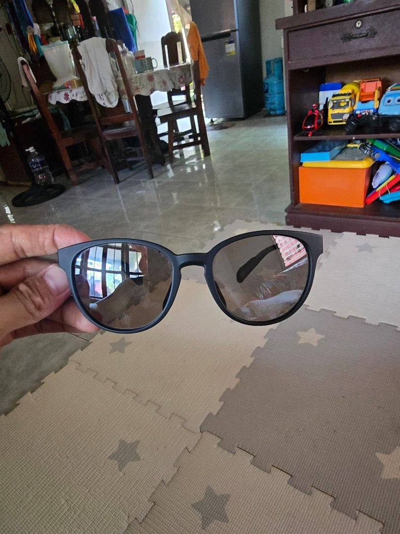 Aunthentic Adidas Sunglasses (Category: Sunglasses & Eyewear) located in Puerto Princesa. Submitted by palawan_vintage (Listing ID 1429737195, Image 1). Description: Black Adidas sunglasses. Includes a black Adidas pouch. The sunglasses have a sleek, modern design with dark lenses. The Adidas logo is visible on the frame and the pouch. The model number is also visible on the frame..