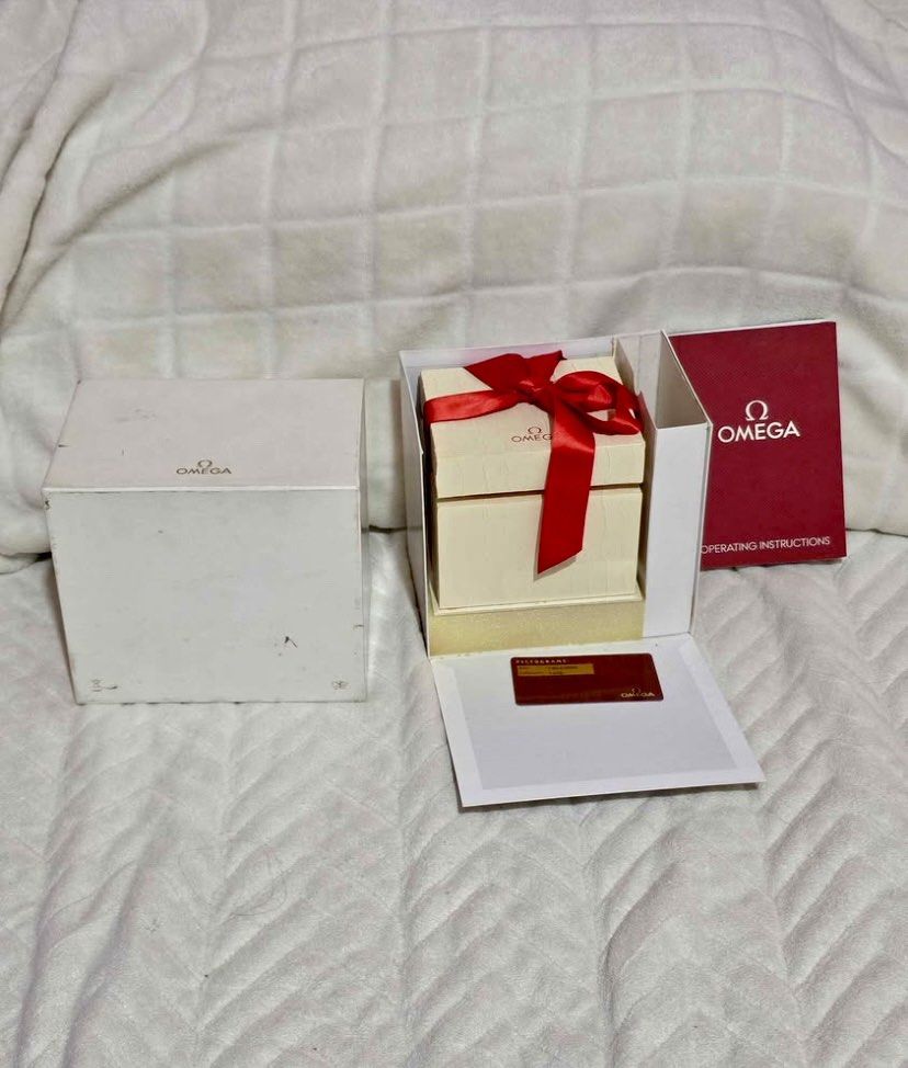 Authentic Omega Constellation Ladies 22MM Watch⌚️ (Category: Luxury Watches) located in Manila. Submitted by luxurycollectionhouse (Listing ID 1429712323, Image 3). Description: Omega Constellation ladies watch. Features a silver dial with Roman numeral hour markers. Includes original box, red pouch, and warranty card. The watch has a stainless steel bracelet. Swiss made..
