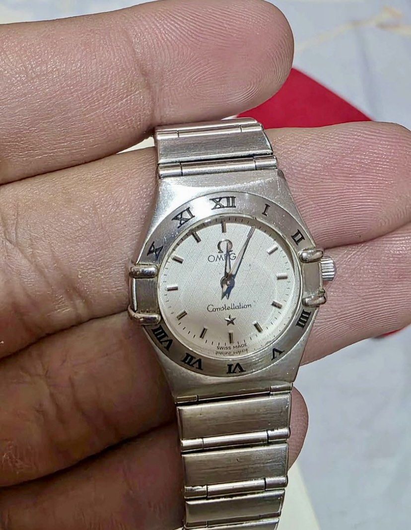 Authentic Omega Constellation Ladies 22MM Watch⌚️ (Category: Luxury Watches) located in Manila. Submitted by luxurycollectionhouse (Listing ID 1429712323, Image 1). Description: Omega Constellation ladies watch. Features a silver dial with Roman numeral hour markers. Includes original box, red pouch, and warranty card. The watch has a stainless steel bracelet. Swiss made..