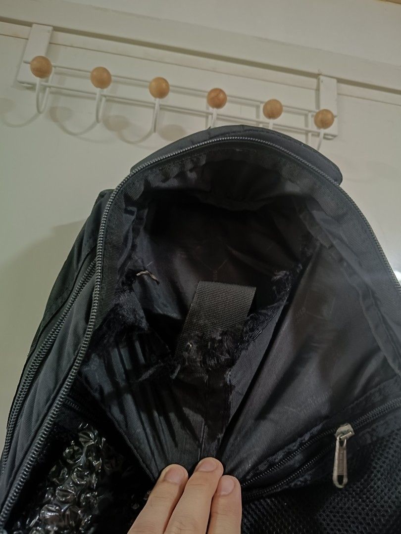 Hawk Black Backpack (Category: Backpacks) located in Iloilo. Submitted by daddy_declutter (Listing ID 1429684881, Image 3). Description: Black backpack with multiple compartments and zippers. Features a logo on the front. Includes adjustable shoulder straps. Suitable for carrying books, laptops, or other essentials..