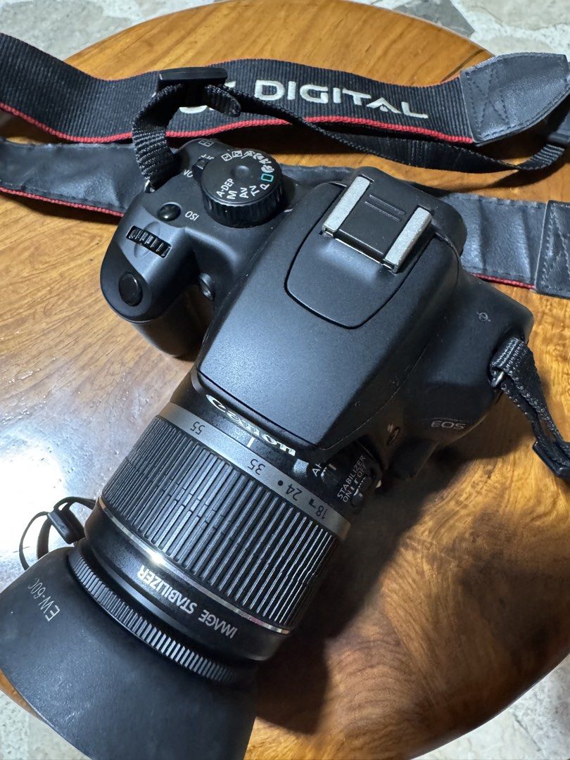 Canon EOS Digital Camera with Lens (Category: Cameras) located in Las Pinas. Submitted by emdjss (Listing ID 1429764596, Image 1). Description: Canon EOS digital camera with lens and strap. Includes a lens hood. Includes a camera strap..