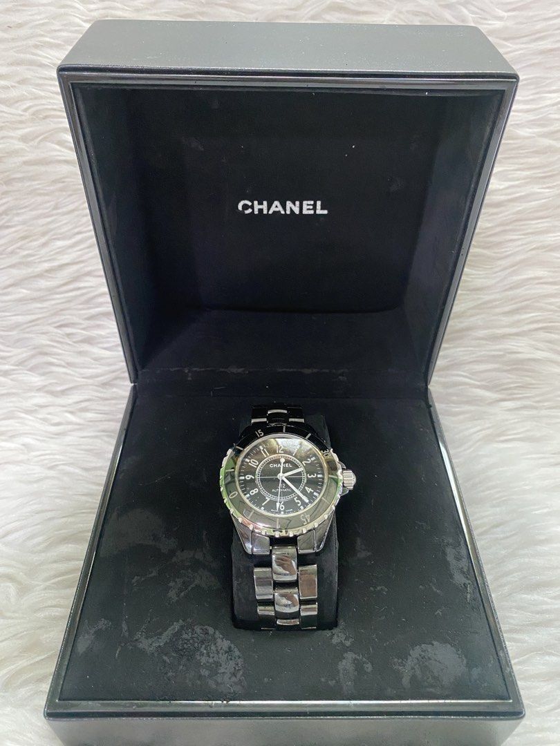 Chanel J12 Automatic Watch (Category: Luxury Watches) located in Malolos. Submitted by yamaguchionline (Listing ID 1429706182, Image 2). Description: Authentic Chanel J12 Automatic watch. Features a black dial with silver-tone hands and markers. The watch has a black ceramic bezel and bracelet. Comes with the original box and papers..