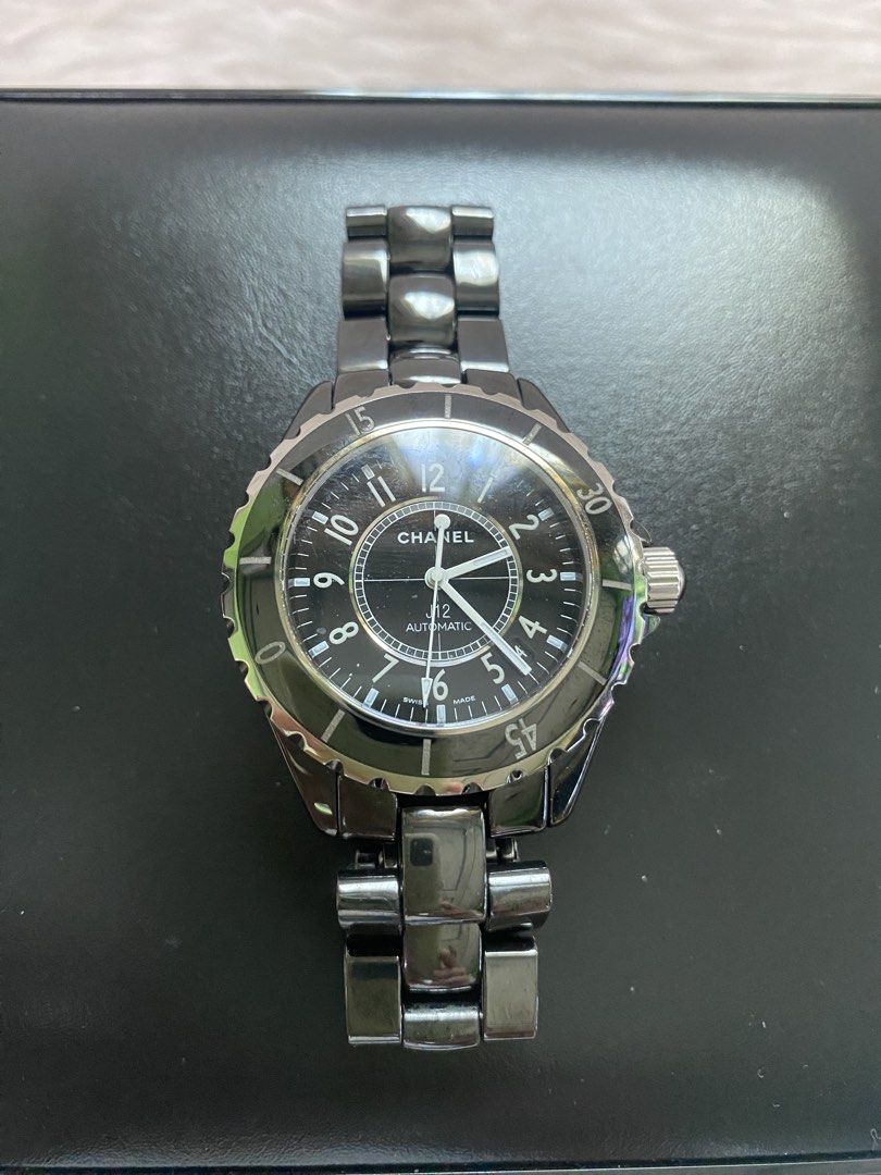 Chanel J12 Automatic Watch (Category: Luxury Watches) located in Malolos. Submitted by yamaguchionline (Listing ID 1429706182, Image 3). Description: Authentic Chanel J12 Automatic watch. Features a black dial with silver-tone hands and markers. The watch has a black ceramic bezel and bracelet. Comes with the original box and papers..