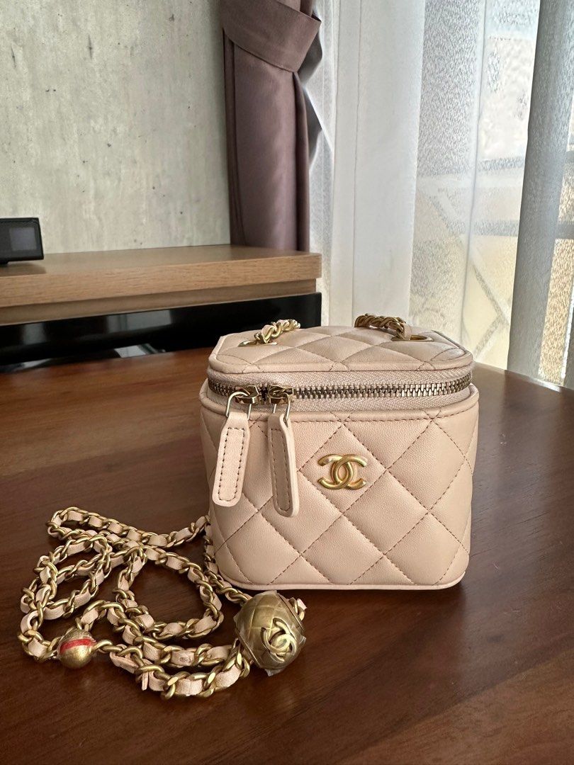 Chanel Pearl Crush Mini Vanity in Beige Lambskin (Category: Bags & Wallets) located in Singapore. Submitted by lovesvintage (Listing ID 1429784376, Image 1). Description: In age gold hardware. Lightly used. Comes with receipt, box and dust bag. RTP: $3710 .