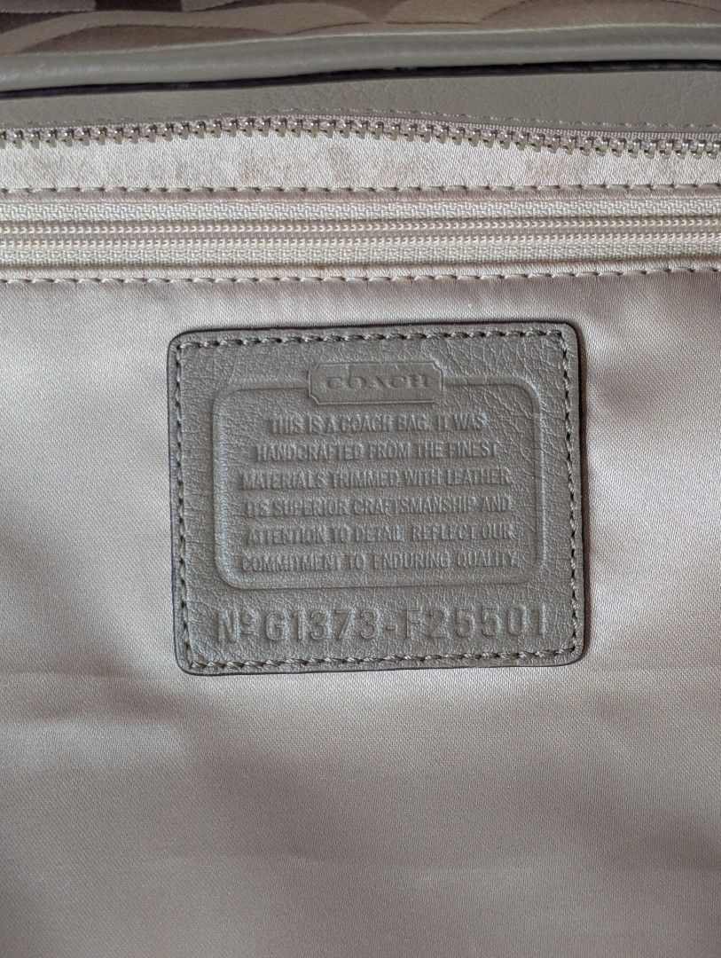 Coach Signature Tote Bag (Category: Luxury Bags & Wallets) located in Manila. Submitted by eladp (Listing ID 1429774337, Image 3). Description: 🌼original preloved items or you money back guaranteed. 🩷details: Coach tote bag in a neutral color. Features a signature pattern and multiple interior pockets. Includes a zipper closure and a Coach hang tag. The bag has double handles and a structured shape. Made in China. 🌼Clean and ready to use. With
