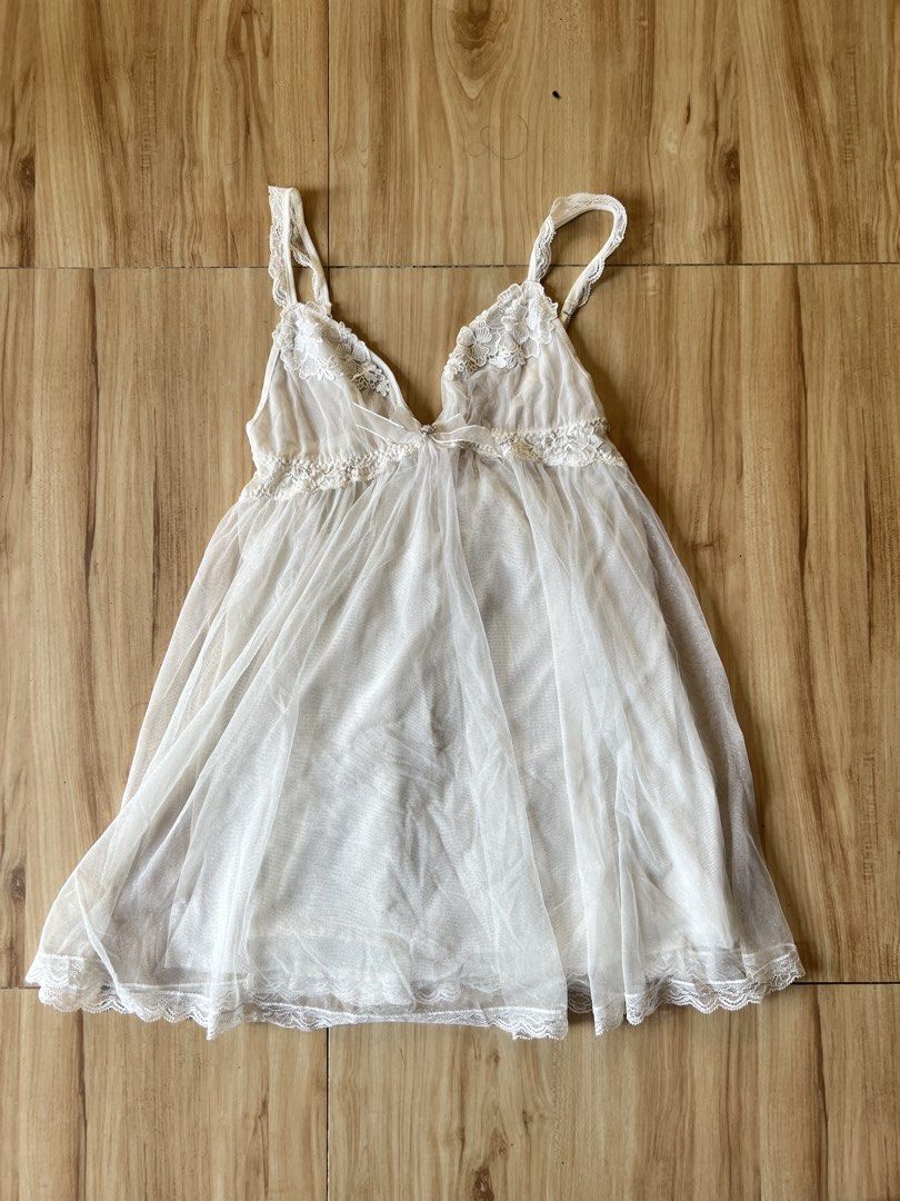 Eblin Lingerie White Babydoll (Category: Undergarments & Loungewear) located in Manila. Submitted by alingmads (Listing ID 1429711900, Image 1). Description: Has 2 flaws. One on the back one on the lower side. See photos for reference. Flaw in back not so noticable due to inner lining. Price negotiable Sf shouldered by buyer.