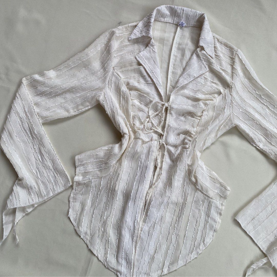 Fairy core Lace up Tie-Front Blouse (Category: Blouses) located in Pagadian. Submitted by picknpack (Listing ID 1425486611, Image 3). Description: •freeszie (self tie) •semi mesh, no issue •magandaaa sa personall🥹💯 •color: cream white.