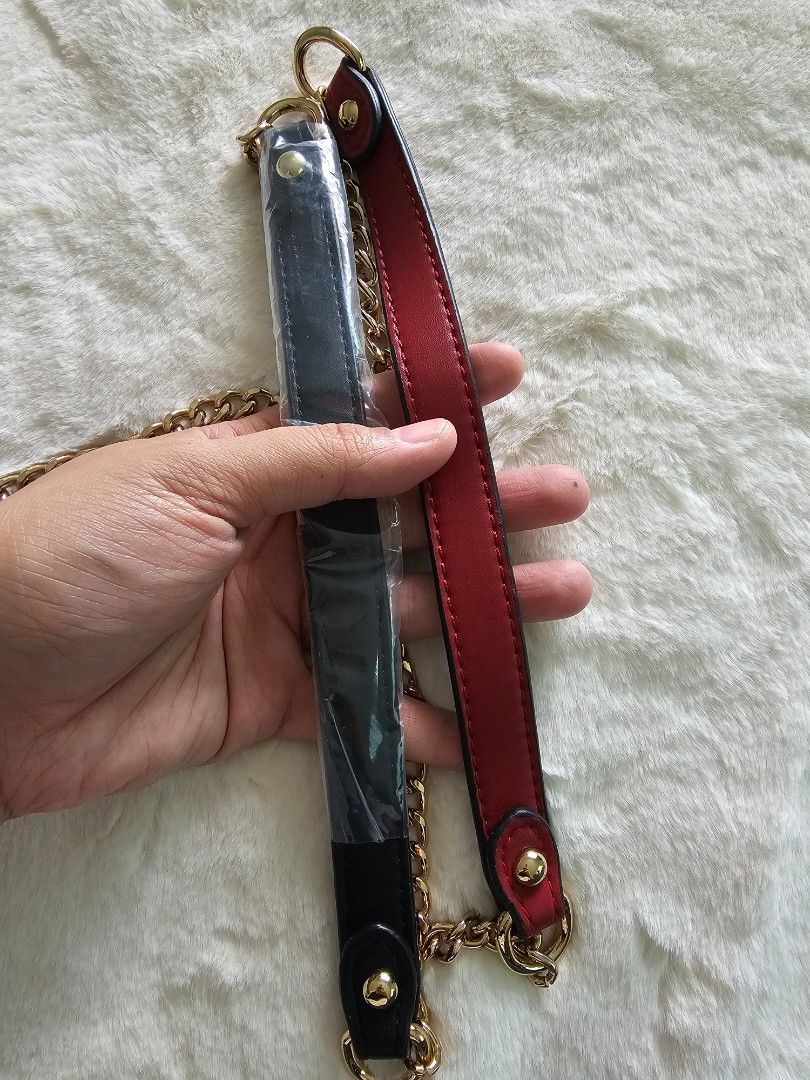 Gold Chain Bag Strap with Leather Handles (Category: Luxury Bags & Wallets) located in Quezon City. Submitted by yourclothesnow (Listing ID 1429811025, Image 2). Description: - Gold chain bag strap - Includes two detachable leather handles: black and red - Features gold-colored clasps for easy attachment - Instantly change the look of your bag all in.