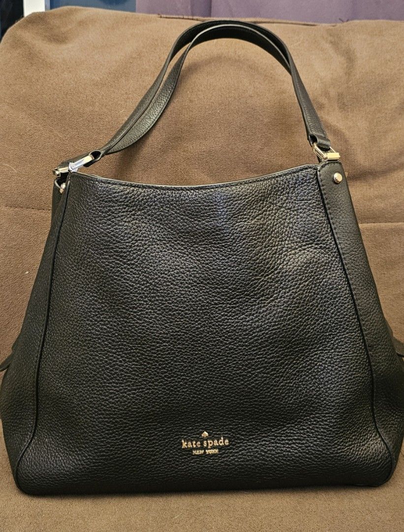 Kate Spade Black Jackson Medium Hobo (Category: Luxury Bags & Wallets) located in Antipolo. Submitted by kiyo5hi_14 (Listing ID 1429685458, Image 2). Description: ​It is a classic, minimalist design known for its soft, grainy leather and spacious "bucket" like shape. You can identify it by several key features visible in your photo: ​Key Identification Features: ​Material: Black pebbled leather (very durable and hides scratches well). ​Hardware: 