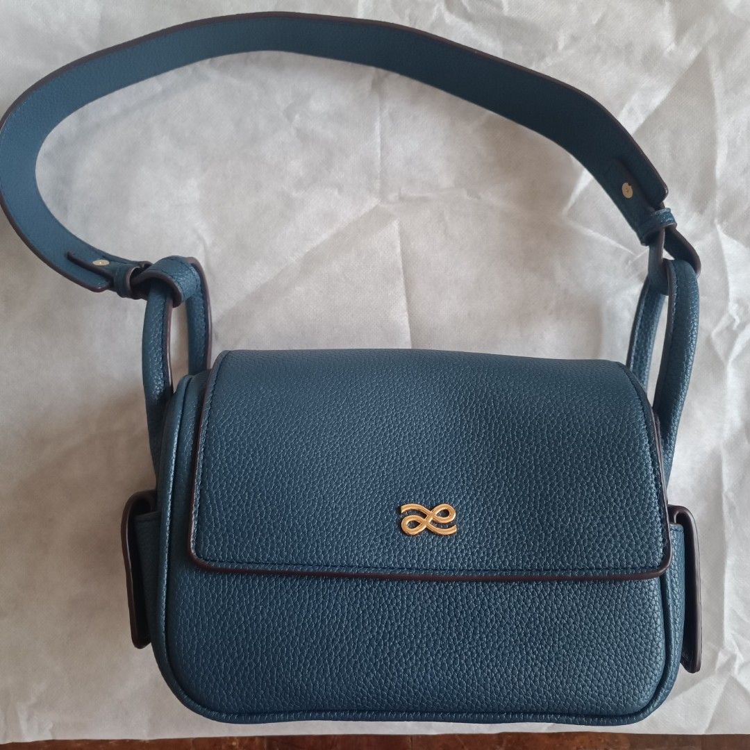Little Bunny Crossbody Bag (Category: Shoulder Bags) located in Quezon City. Submitted by firstlovedbyb (Listing ID 1429713340, Image 1). Description: Authentic House Of Littlebunny 20cm Treasure Bag. Color: Bluenuit. Material: PU. With gold hardware. With long guitar strap and short strap. Can be used as a sling bag and shoulder bag. Bought in Bangkok, Thailand. No flaws. Good as new✨ .