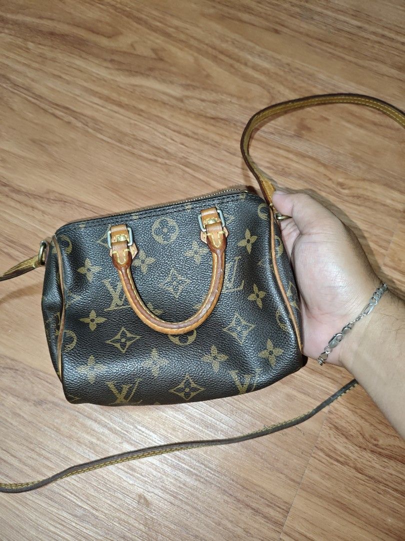 Louis Vuitton Nano Speedy Monogram (Category: Luxury Bags & Wallets) located in Taguig. Submitted by jamesssssg. (Listing ID 1429753060, Image 2). Description: Authentic Louis Vuitton Nano Speedy handbag in Monogram canvas. Features a top handle and a detachable shoulder strap. The interior includes a small pocket. The zipper pull is engraved with the LV logo. The date code is TS3157. Made in France..