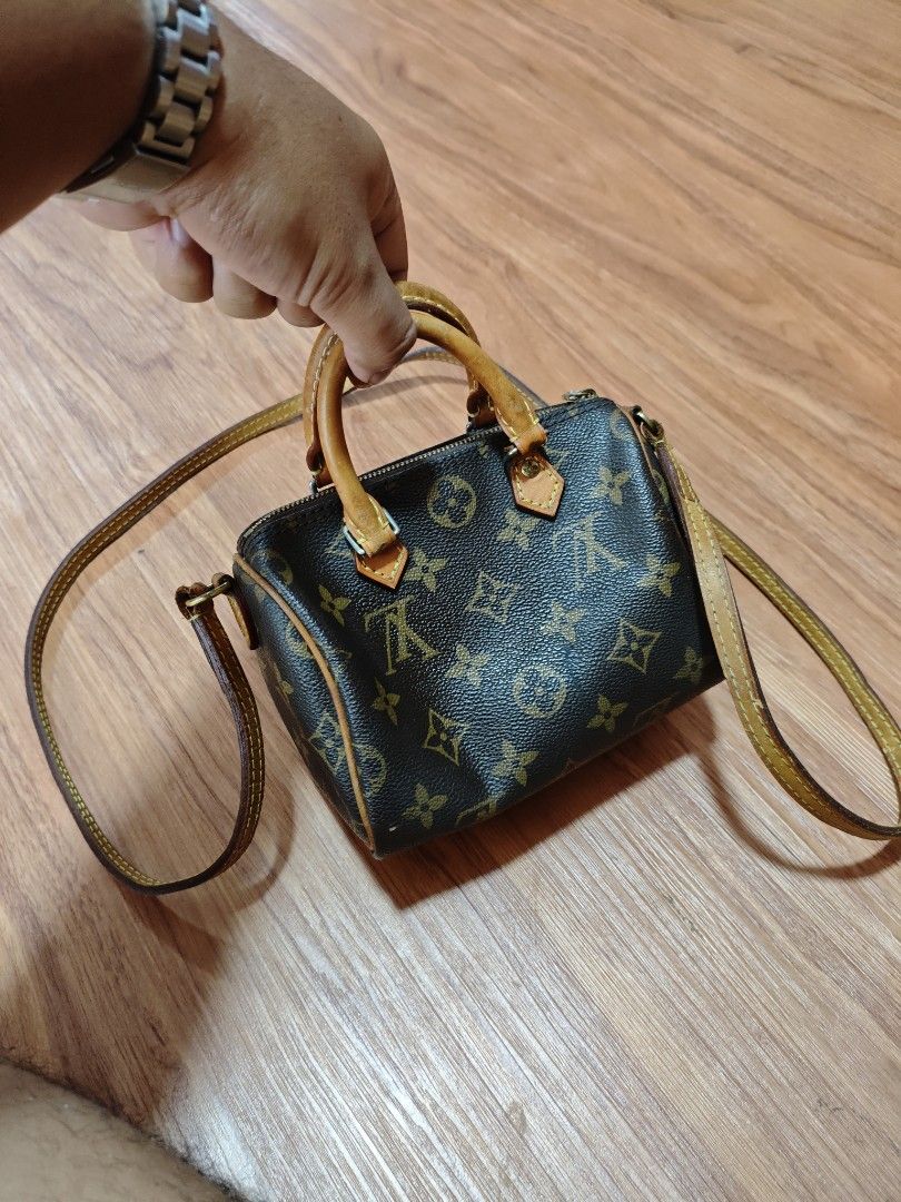 Louis Vuitton Nano Speedy Monogram (Category: Luxury Bags & Wallets) located in Taguig. Submitted by jamesssssg. (Listing ID 1429753060, Image 1). Description: Authentic Louis Vuitton Nano Speedy handbag in Monogram canvas. Features a top handle and a detachable shoulder strap. The interior includes a small pocket. The zipper pull is engraved with the LV logo. The date code is TS3157. Made in France..