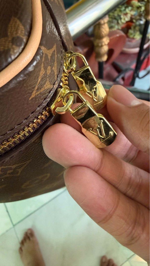 Louis Vuitton Nice Vanity Case Set (Category: Luxury Bags & Wallets) located in Cabuyao City. Submitted by girliecloset202434 (Listing ID 1429710645, Image 3). Description: Set of two Louis Vuitton vanity cases. The cases feature the iconic LV monogram pattern and gold-tone hardware. The interior is lined with a light-colored material and includes a small pocket. The cases have a zip closure and a top handle. The smaller case has a red handle. Co