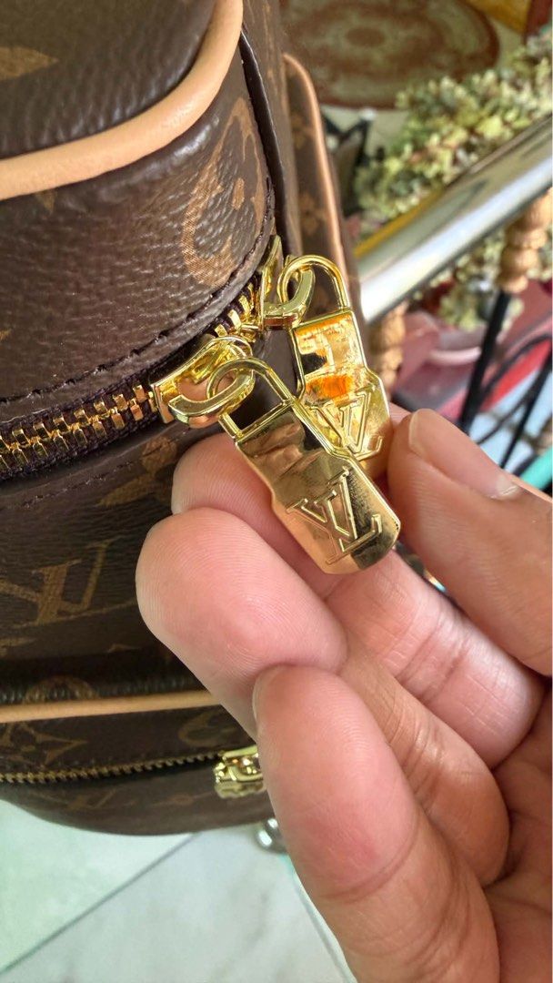 Louis Vuitton Nice Vanity Case Set (Category: Luxury Bags & Wallets) located in Cabuyao City. Submitted by girliecloset202434 (Listing ID 1429710645, Image 2). Description: Set of two Louis Vuitton vanity cases. The cases feature the iconic LV monogram pattern and gold-tone hardware. The interior is lined with a light-colored material and includes a small pocket. The cases have a zip closure and a top handle. The smaller case has a red handle. Co