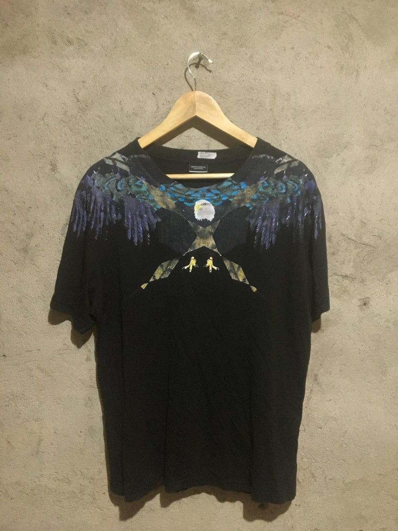 Marcelo Burlon Eagle Graphic T-shirt - Size L (Category: Tshirts & Polo Shirts ) located in Surigao. Submitted by paulcorbeta (Listing ID 1429801075, Image 1). Description: 20/26 excellent condition ✅ issue minimal hairlines 📍MINDANAO,SURIGAO CITY/8400.