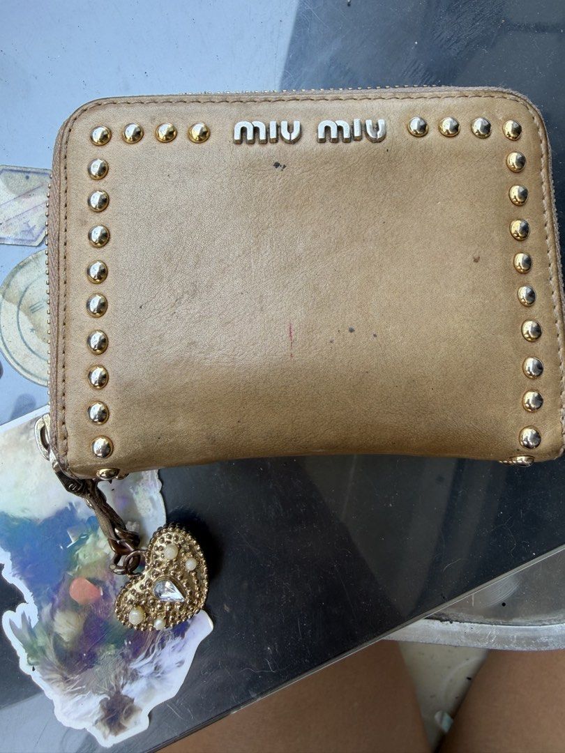 Miu Miu Studded Leather Wallet (Category: Luxury Bags & Wallets) located in Manila. Submitted by fcd2410 (Listing ID 1429699154, Image 2). Description: Sf shouldered by buyer. manage expectations as it is well used .