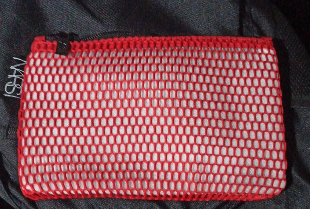 NARS Mesh Cosmetic Make up Pouch (Category: Makeup) located in Manila. Submitted by PureWonder_Shop (Listing ID 1416465343, Image 3). Description: 🇺🇸 NARS red mesh cosmetic bag - Features a zipper closure - Made of soft mesh material, not a nylon - Includes a small NARS label - Ideal for storing makeup and small items - Great for travel or everyday use 9" x 6" Can fit most iphones Color: Red 🧁.