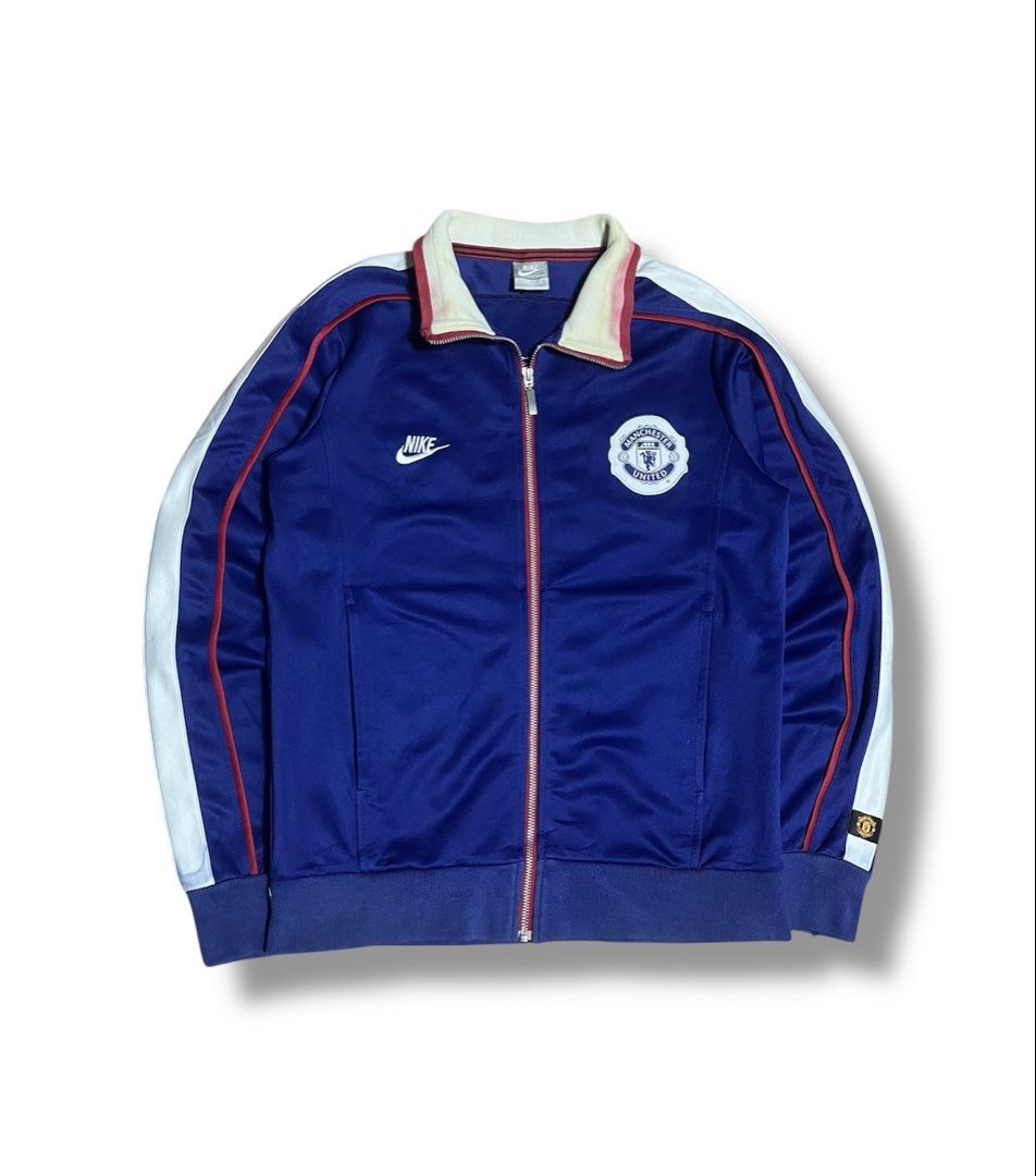 Nike Manchester United Track Jacket (Category: Coats, Jackets and Outerwear) located in Bulacan. Submitted by sanjisthrift (Listing ID 1429689683, Image 1). Description: Size Small Width 20 Length 25.5 Well Used 9/10 Stains Minimal distress.