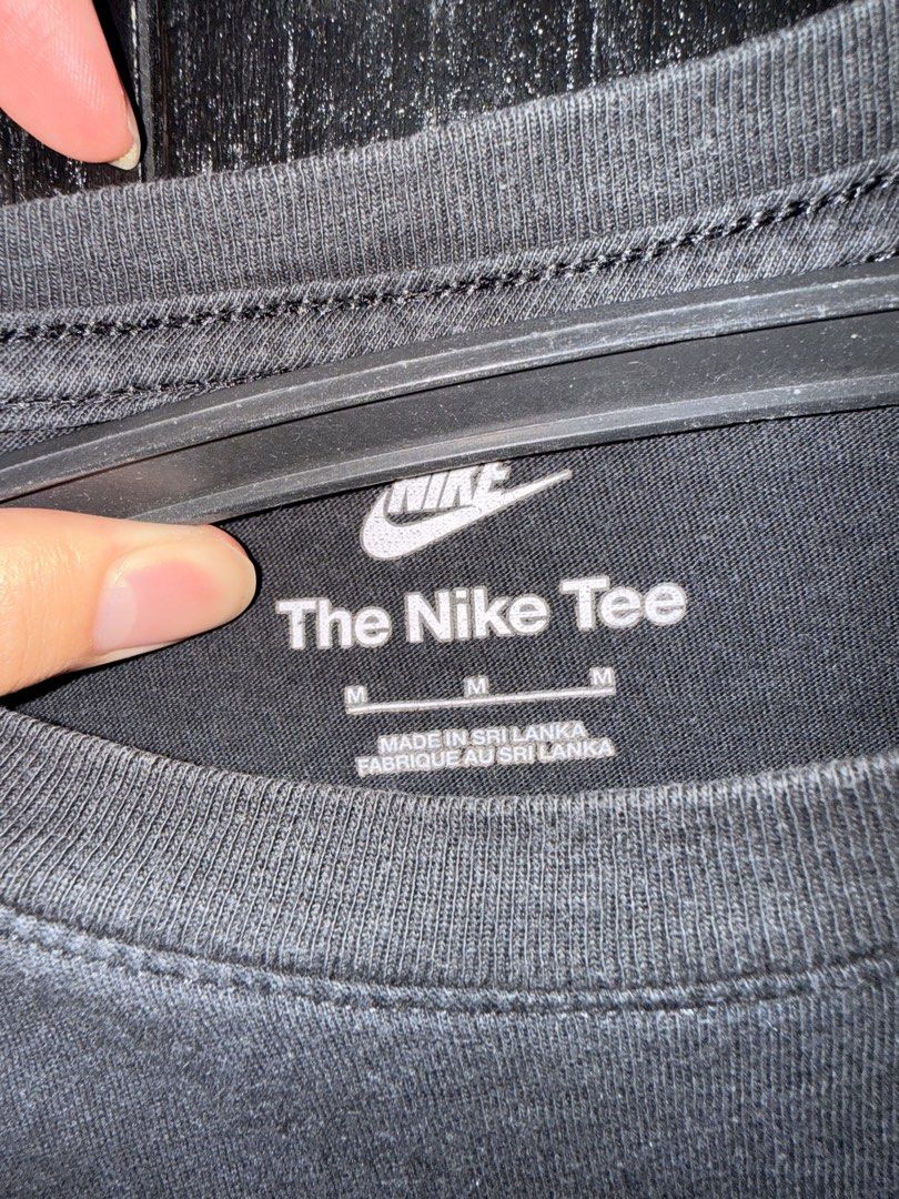Nike The Nike Tee Black Shirt (Category: Tshirts & Polo Shirts ) located in Paranaque City. Submitted by jayvee7 (Listing ID 1429677440, Image 2). Description: Black Nike T-shirt. Features the Nike logo on the front and "The Nike Tee" text. Made in Sri Lanka. Size M. Simple and versatile, perfect for everyday wear. The shirt is a classic black color, making it easy to pair with various outfits. Size Medium Only used twice Bought in Thailand RFS: 