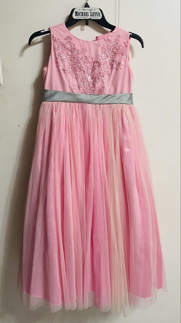 Pink Formal Gown (Category: Babies & Kids Fashion) located in Quezon City. Submitted by kheekai (Listing ID 1429792635, Image 1). Description: Elegant pink formal gown. Features a detailed embroidered bodice and a flowing tulle skirt. Includes a silver-grey ribbon at the waist. Perfect for special occasions. Sleeveless design. Fit 7-10, depends on body built.
