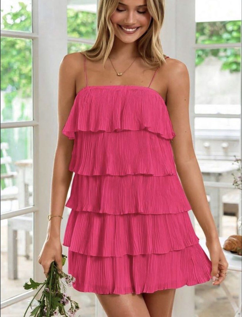 Pink Tiered Mini Dress (Category: Dresses) located in Manila. Submitted by cailleshope (Listing ID 1429719026, Image 1). Description: Vibrant pink mini dress features a tiered design with delicate spaghetti straps. The dress is made of pleated fabric, offering a flowy and flattering silhouette. It is a size M Perfect for a casual day out or a special occasion..