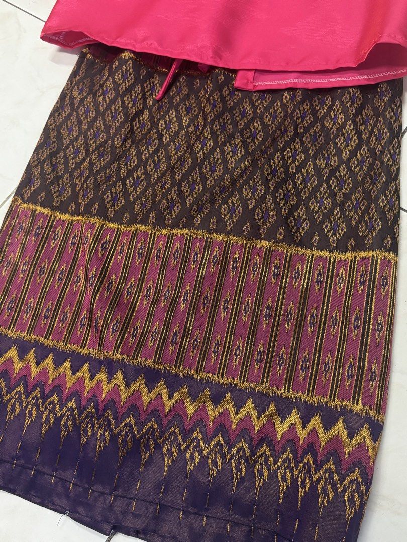 Pink Top and Patterned Skirt Set (Category: Sets or Coordinates) located in Quezon City. Submitted by silverls7 (Listing ID 1429730766, Image 2). Description: Set and top filipiniana set!! Set features a vibrant pink top with puff sleeves and a matching patterned skirt. The skirt showcases a detailed design with a combination of brown, gold, and purple hues. The top has a tie closure at the front. This set is perfect for special occasions or addi