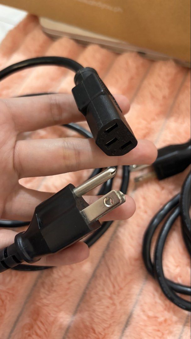 Power Cables - US Plug (Category: Cables & Adaptors) located in Mandaluyong City. Submitted by jaaustria20 (Listing ID 1429744666, Image 2). Description: Set of black power cables with US plugs. Includes multiple cables with the standard 3-prong plug on one end and the IEC C13 connector on the other. Suitable for various devices like computers, monitors, and other electronics..